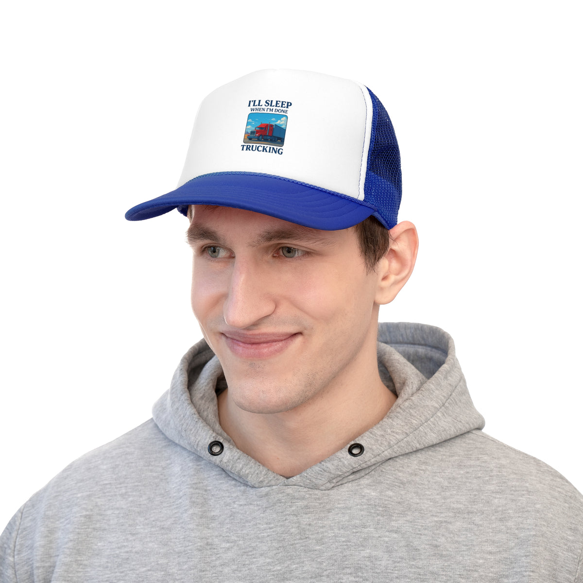 Black trucker cap with "I'll Sleep When I'm Done Trucking" slogan, designed for truck drivers, featuring a classic mesh hat style.