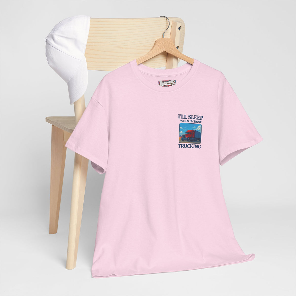 Light blue unisex heavy cotton T-shirt with "I'll Sleep When I'm Done Trucking" print, by Printify.