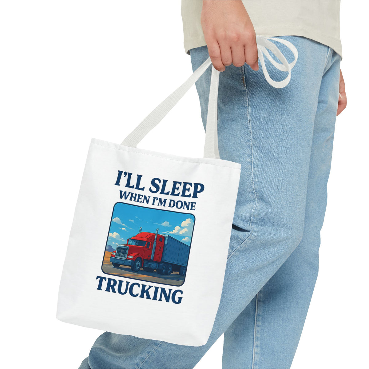 Black truck driver tote bag with white text saying "I'll Sleep When I'm Done," ideal for truckers and as a gift.
