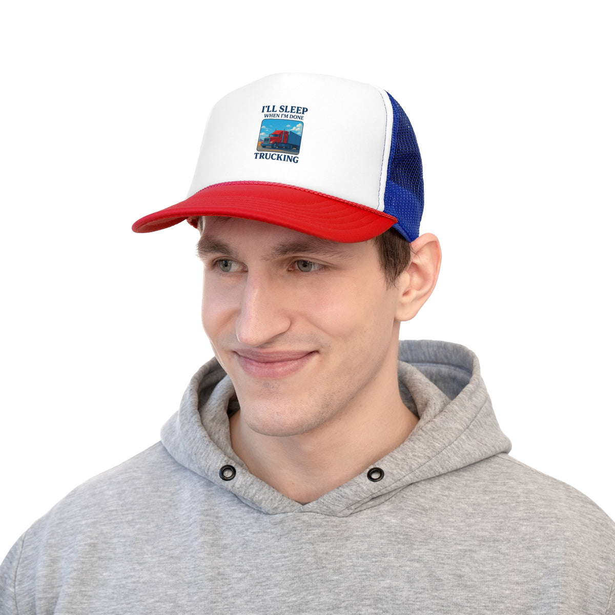 Black trucker cap with "I'll Sleep When I'm Done Trucking" slogan, featuring mesh back, ideal for truck drivers.