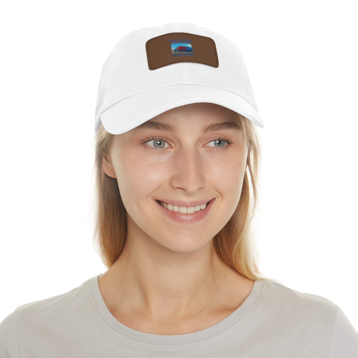 White trucking dad hat with a light brown leather patch and full sleep design, featuring a classic adjustable baseball cap style.