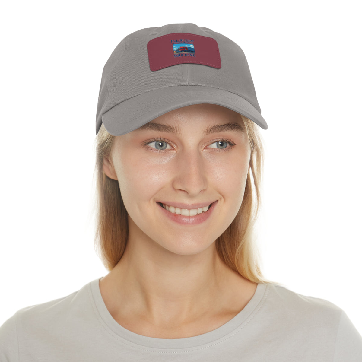 White trucking dad hat with a leather patch and full sleep design, featuring a rectangle logo and adjustable strap.