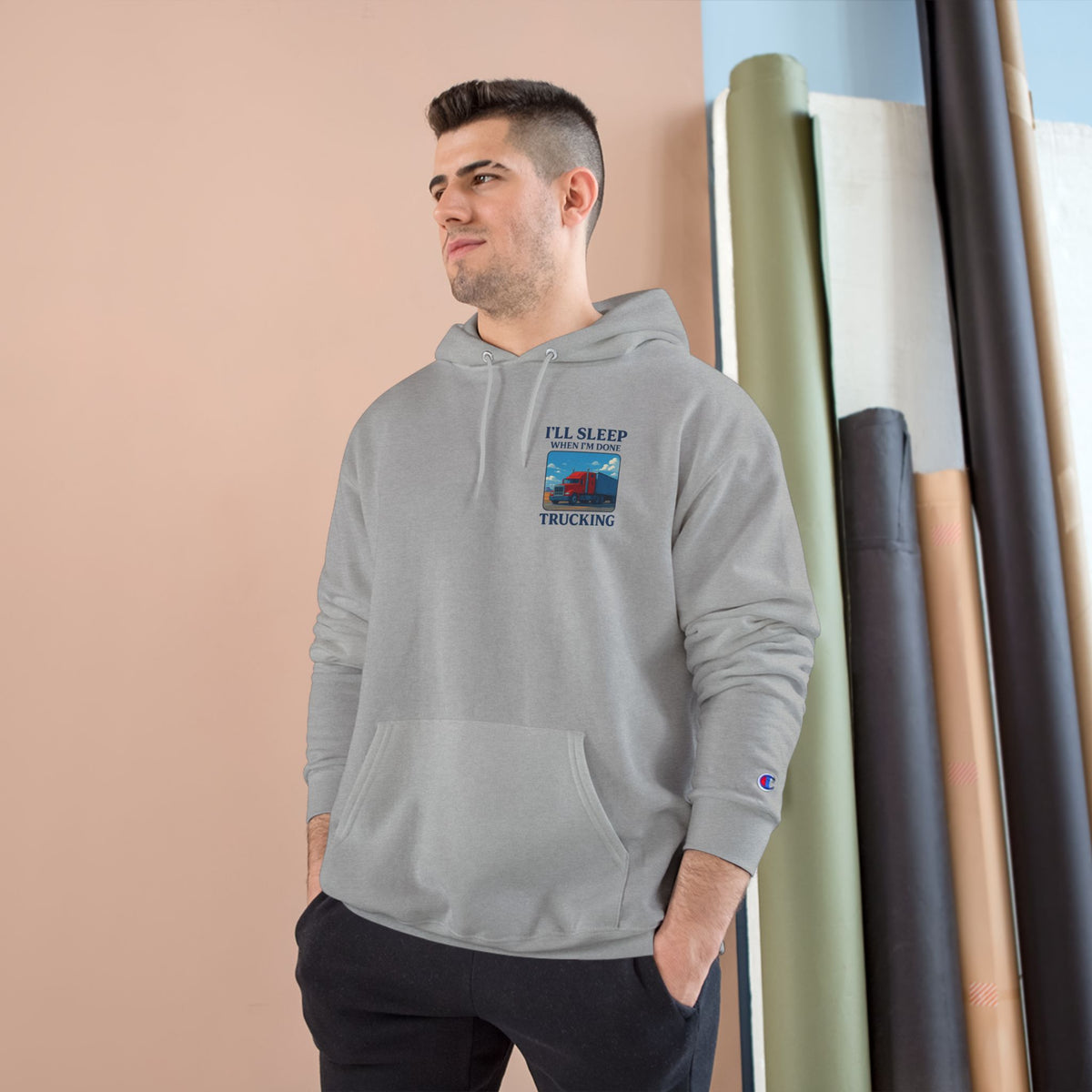 Light steel truck driver hoodie with motivational text "I'll Sleep When I'm Done" by Printify, featuring a casual fit and truck graphic.