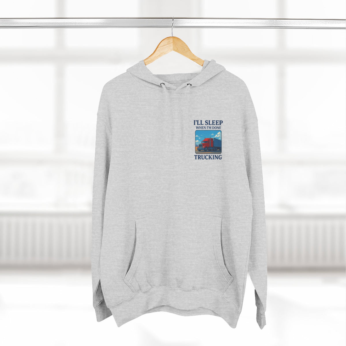 Heather grey Trucker's Fleece Hoodie by Printify with "I'll Sleep When I'm Done" slogan, cozy and casual for everyday wear