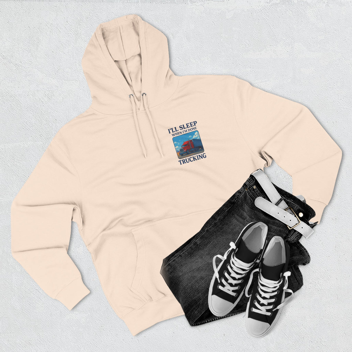 Heather grey Trucker's Fleece Hoodie by Printify featuring the slogan "I'll Sleep When I'm Done" on the front.