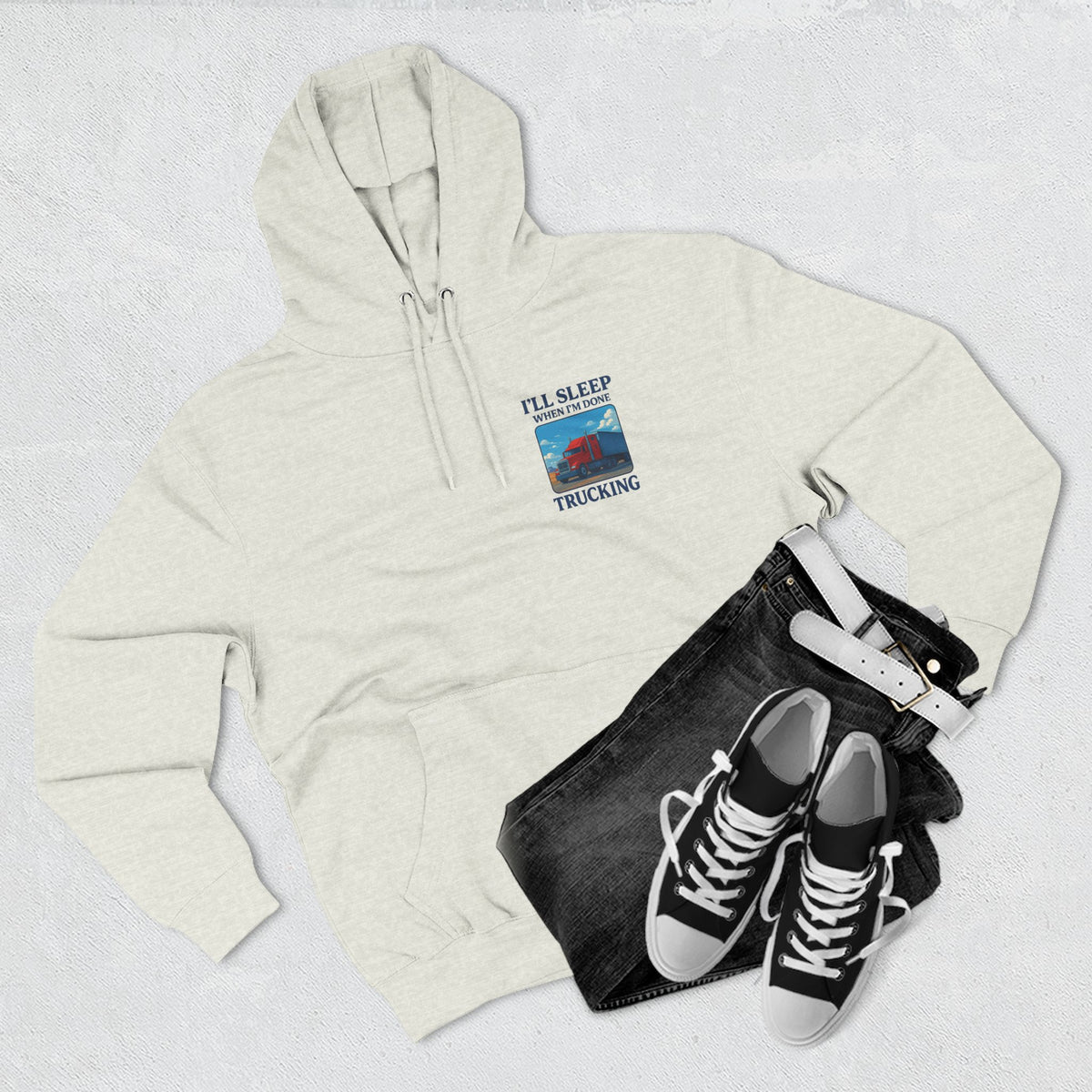Heather grey Trucker's Fleece Hoodie by Printify featuring the slogan "I'll Sleep When I'm Done" on the front.