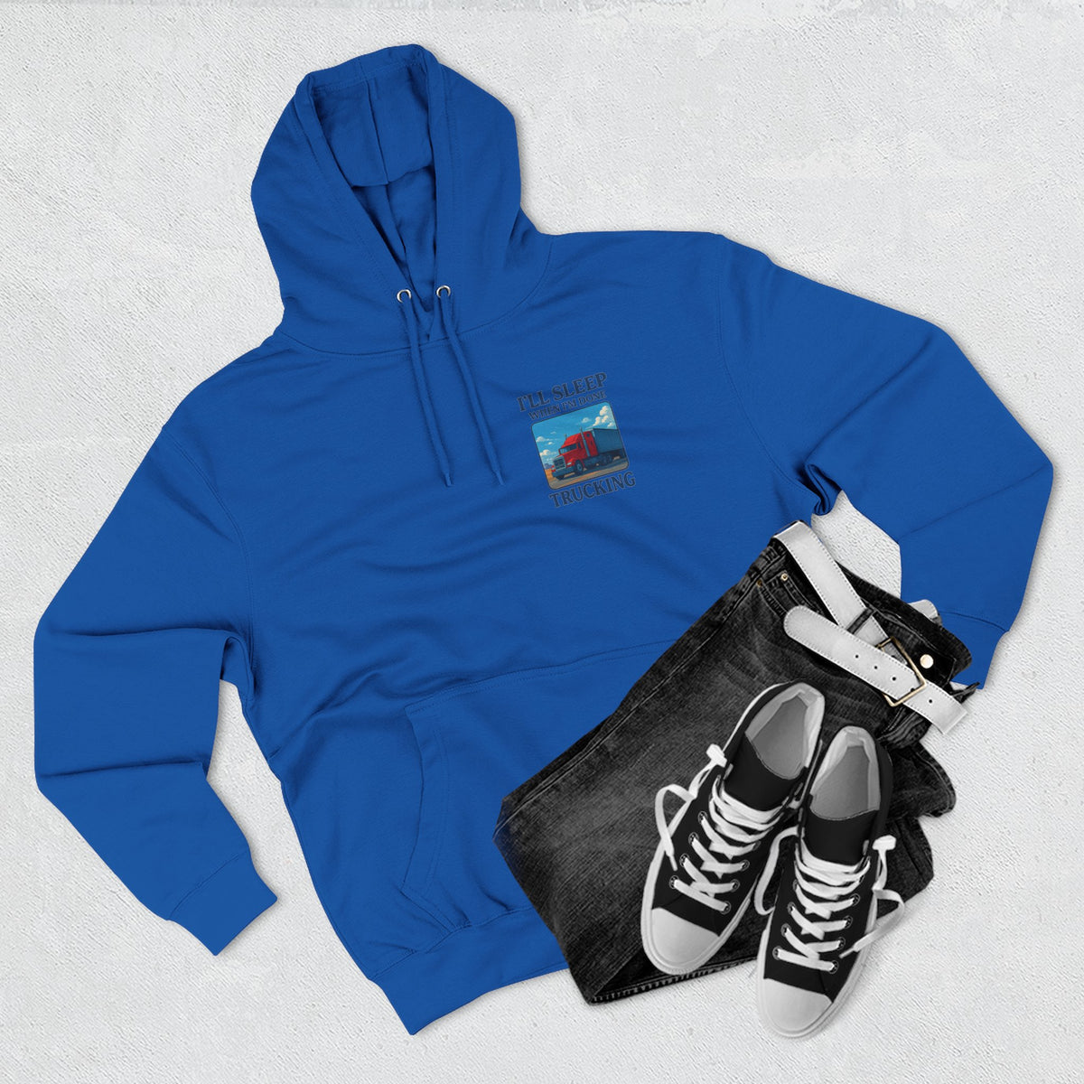 Heather grey Trucker's Fleece Hoodie by Printify featuring the slogan "I'll Sleep When I'm Done" on the front.