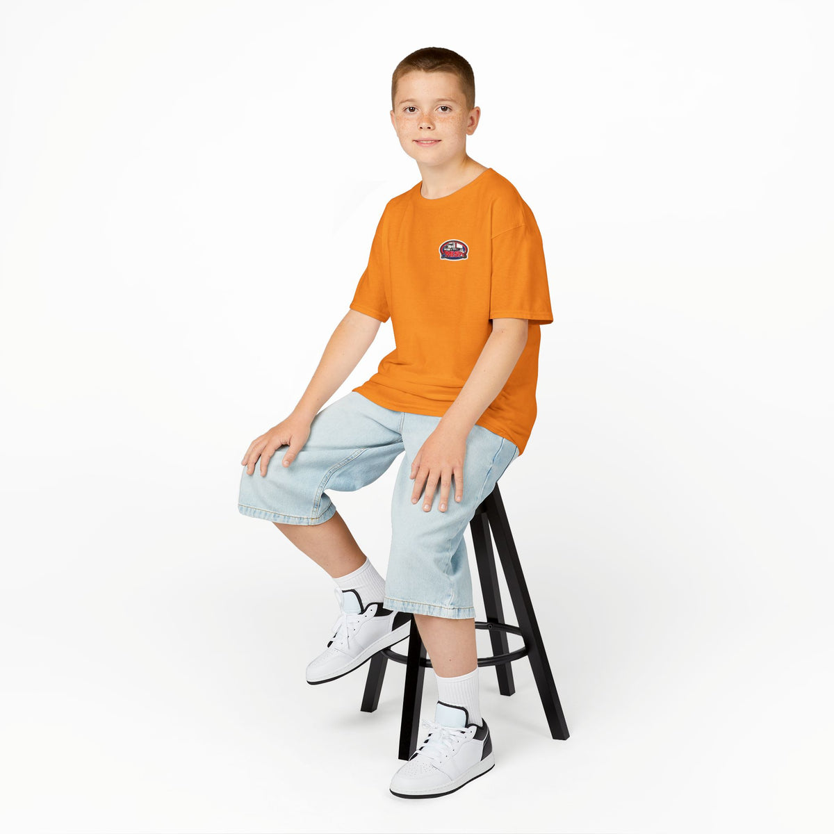 Red kids heavy cotton tee with humorous truck parking graphic for young adventurers, by Printify.