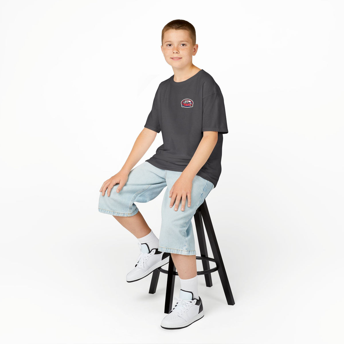 Red kids heavy cotton tee featuring humorous truck parking design, perfect for young adventurers, by Printify.