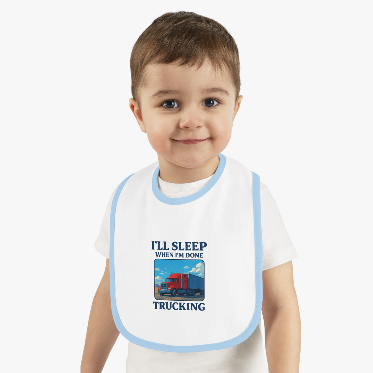 Funny Trucking Baby Bib by Printify featuring "I'll Sleep When I'm Done" text, in white and black, for kids' clothing.