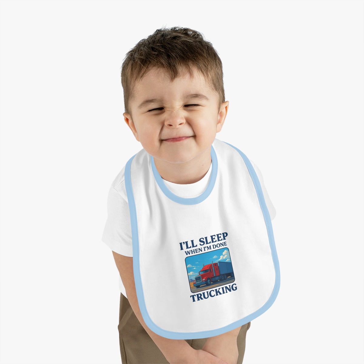 Funny trucking baby bib from Printify with "I'll Sleep When I'm Done" text, featuring a white background and black lettering.