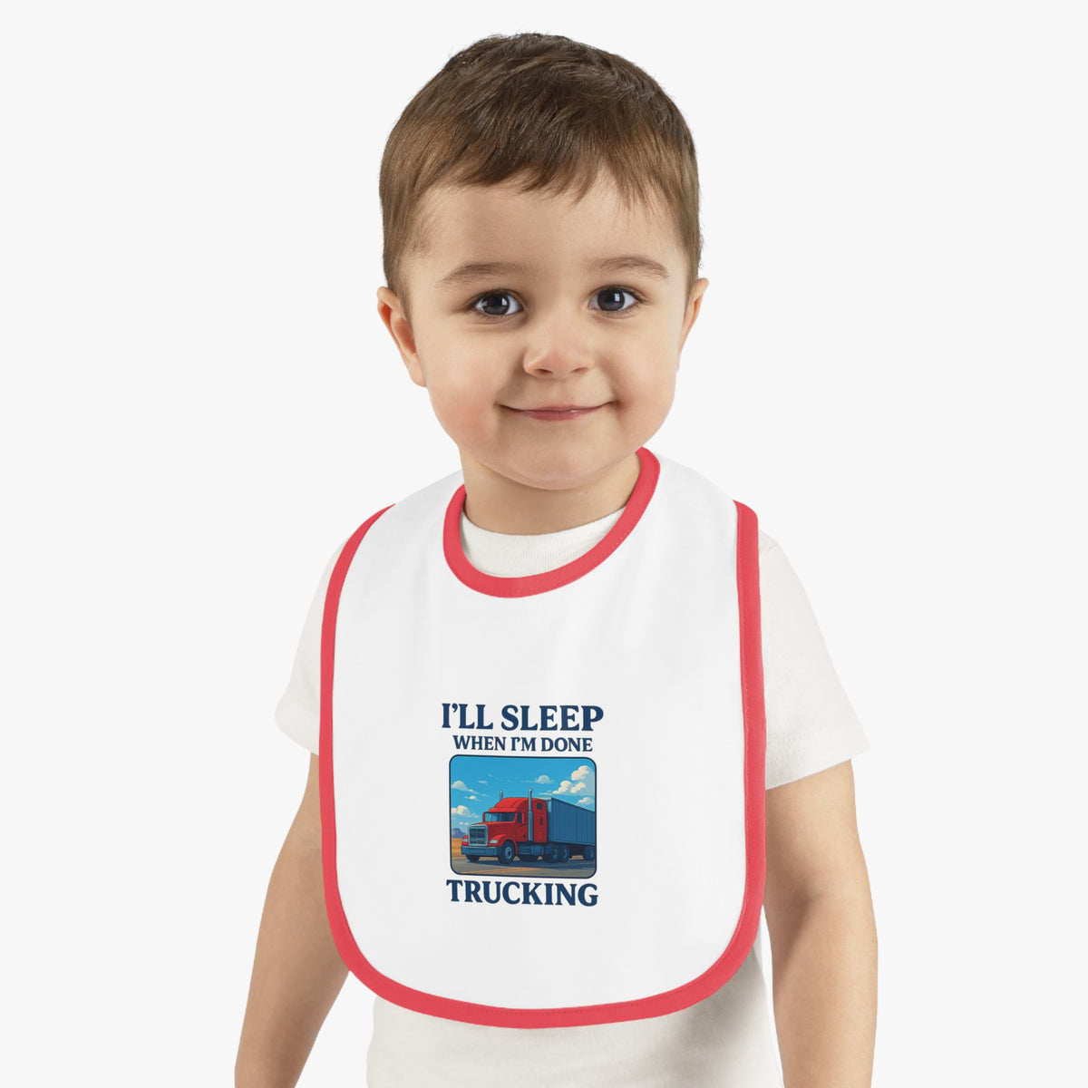 Funny trucking baby bib by Printify with "I'll Sleep When I'm Done" text, made for kids, in white and black, one size.
