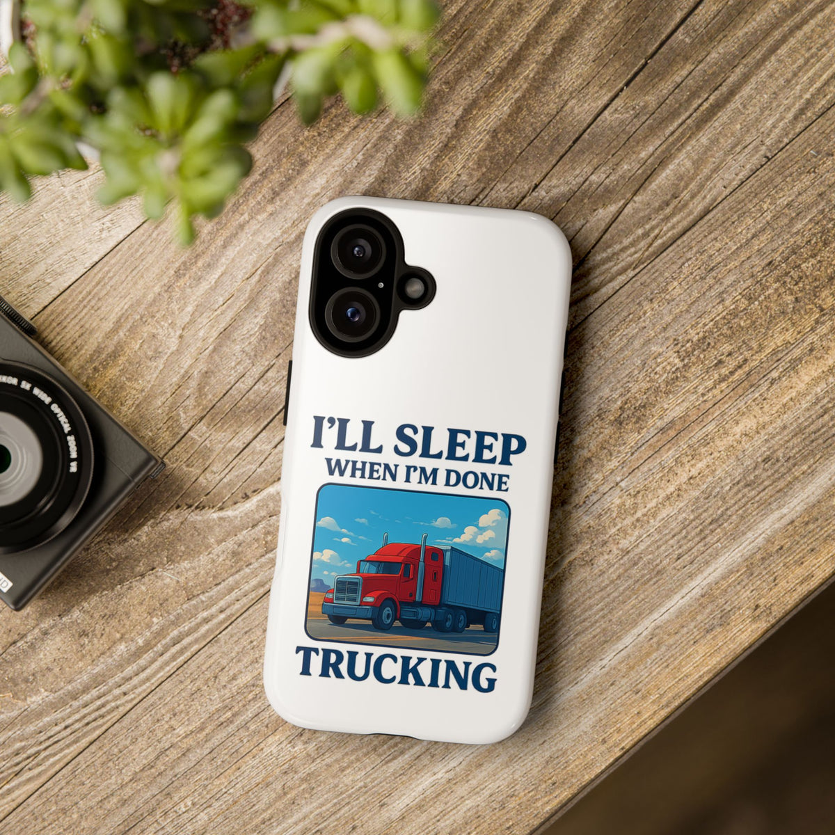 Glossy iPhone 16 Pro trucker phone case with humorous 'I'll Sleep When I'm Done Trucking' print by Printify