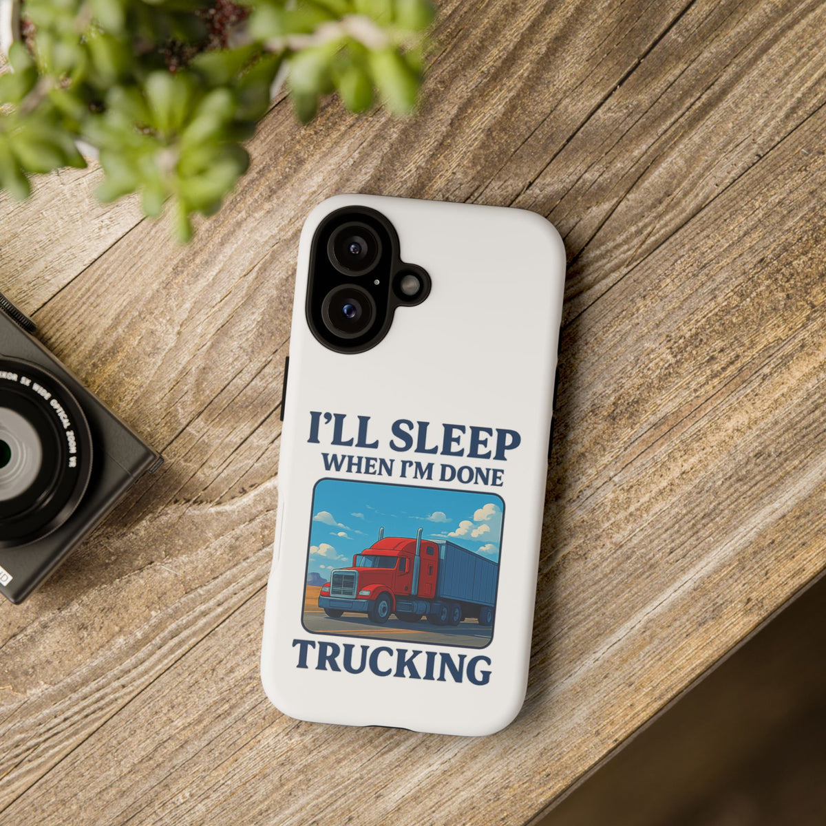 Glossy iPhone 16 Pro trucker phone case with "I'll Sleep When I'm Done Trucking" design by Printify.