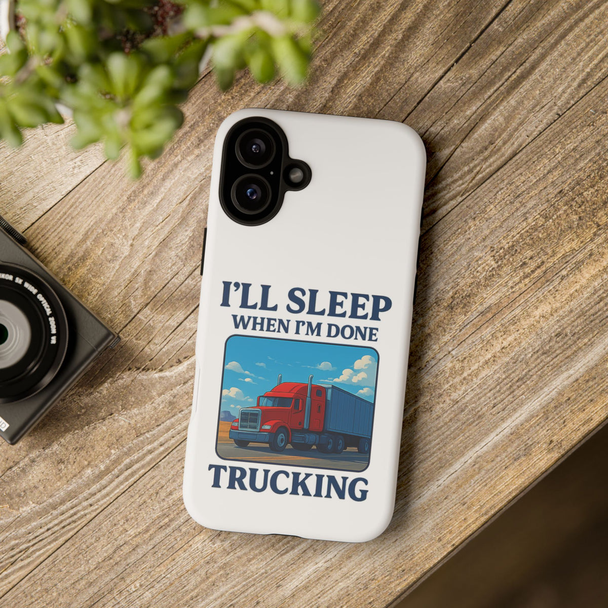 Glossy iPhone 16 Pro trucker phone case with humorous "I'll Sleep When I'm Done Trucking" design by Printify