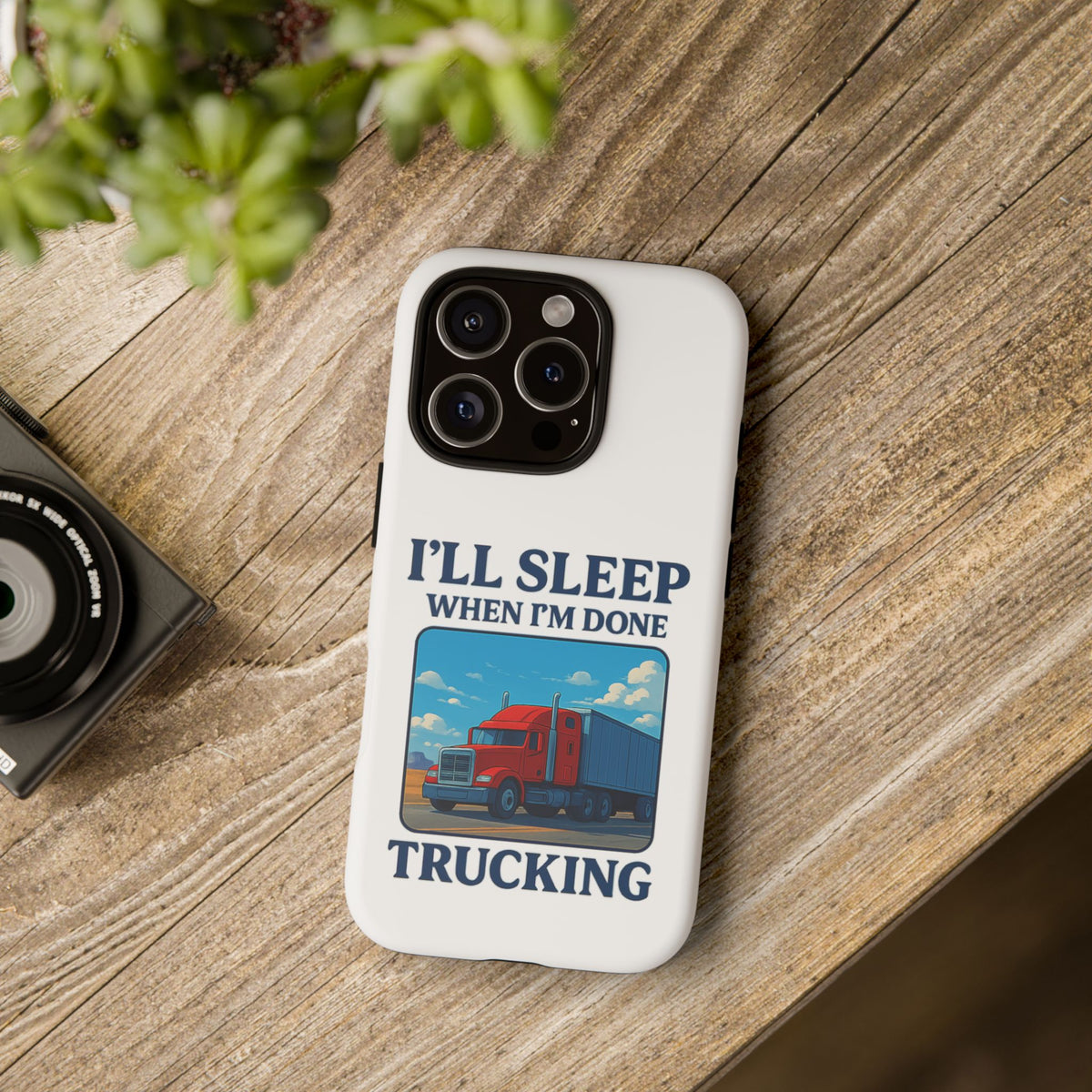Glossy iPhone 16 Pro trucker phone case with "I'll Sleep When I'm Done Trucking" print by Printify, featuring a trucking design.