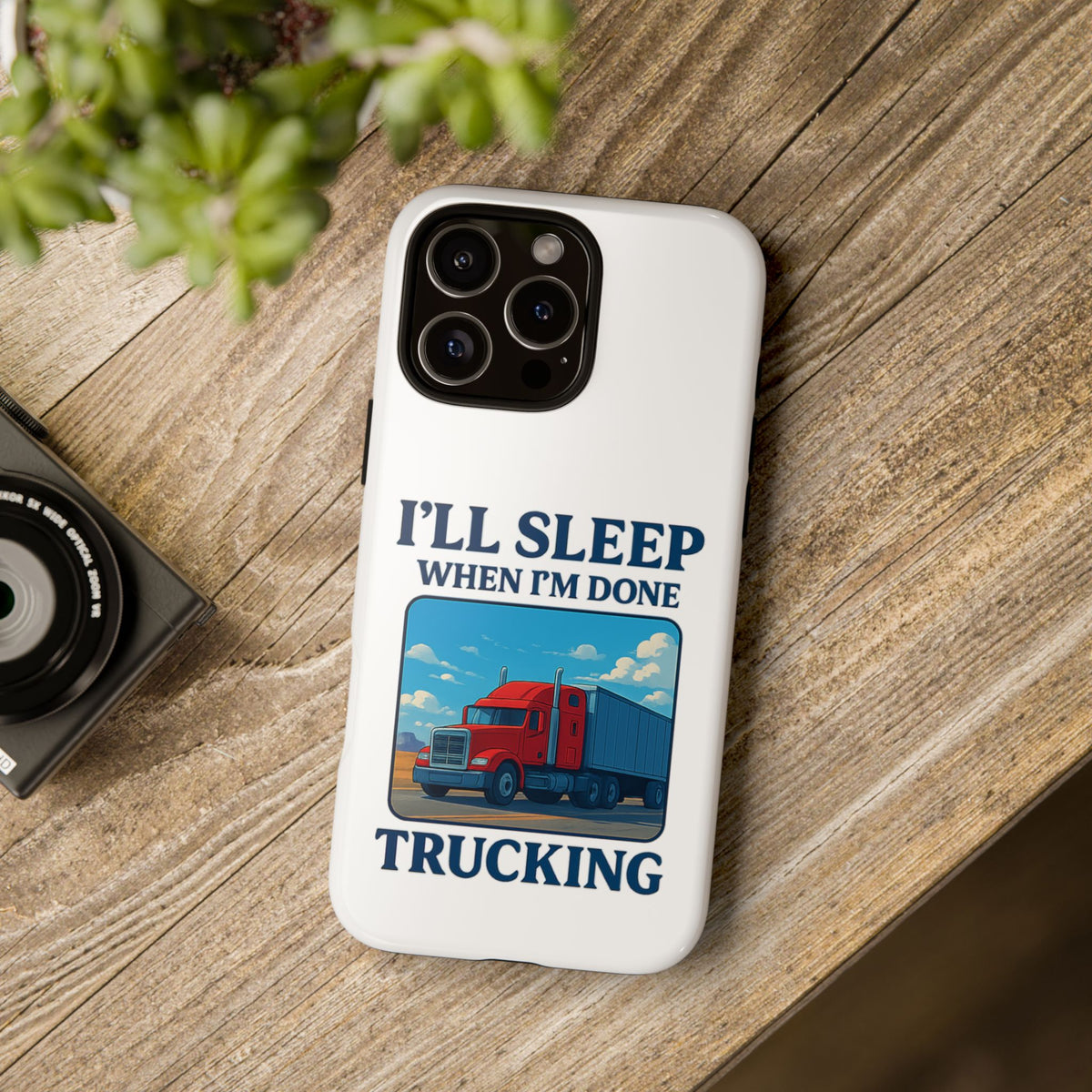 Glossy iPhone 16 Pro trucker phone case with "I'll Sleep When I'm Done Trucking" design by Printify.