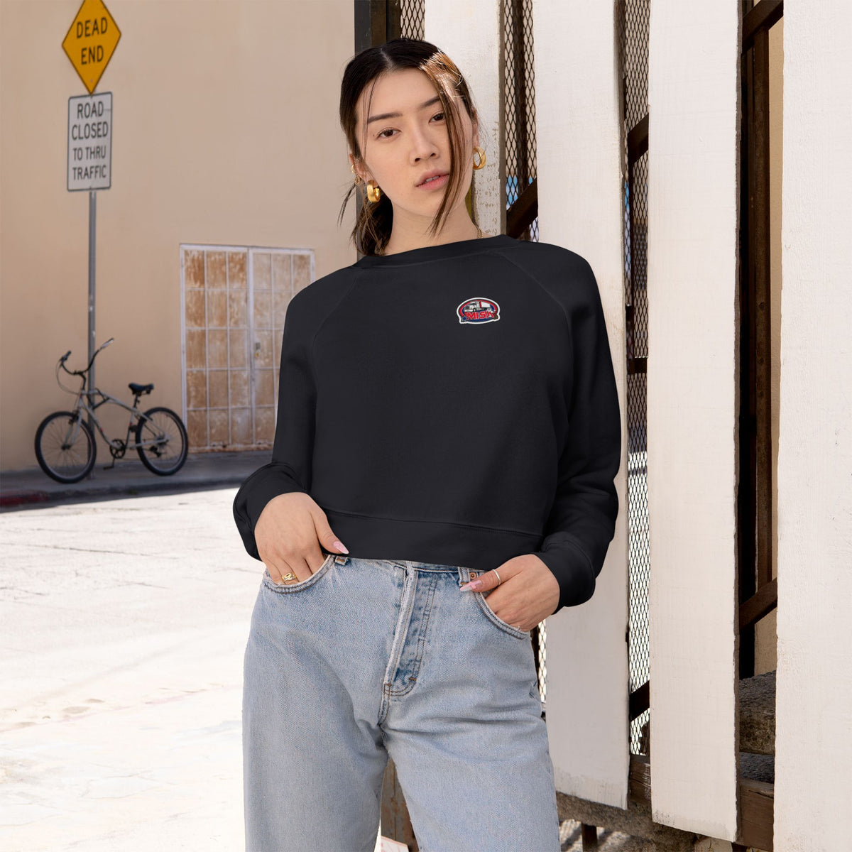Black women's cropped fleece sweatshirt with colorful graphic design, cozy fit, from Printify.