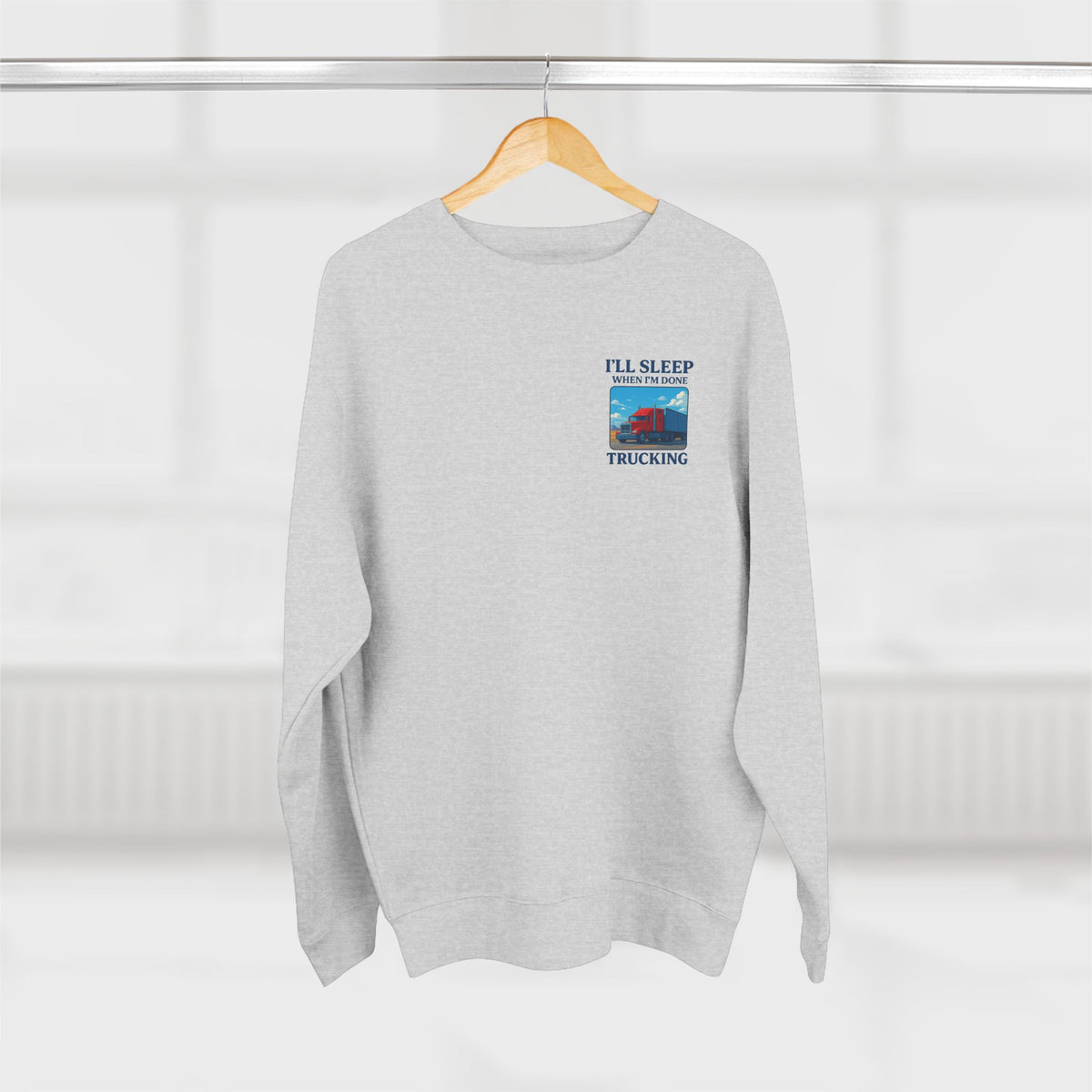 Heather grey Trucker Life unisex crewneck sweatshirt with "I'll Sleep When I'm Done" graphic design by Printify.