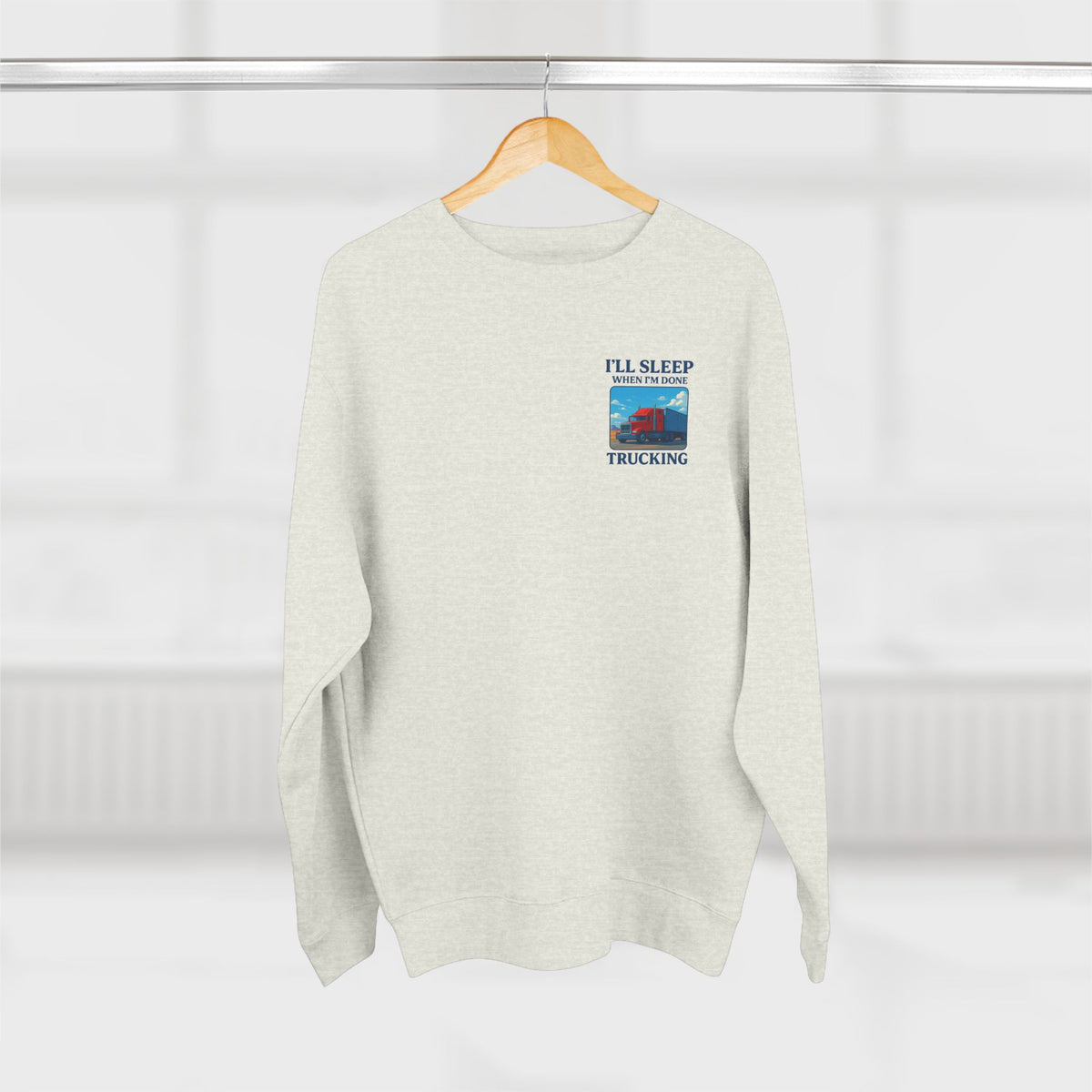 Heather grey Trucker Life unisex crewneck sweatshirt with "I'll Sleep When I'm Done" print, comfortable casual apparel.