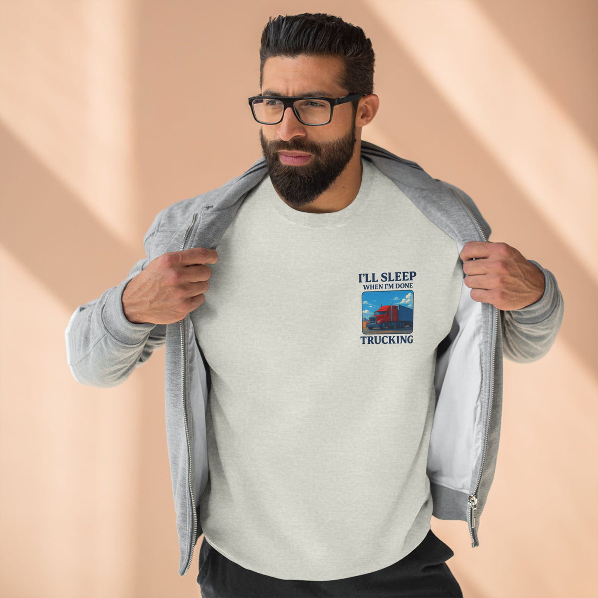 Heather grey Trucker Life unisex crewneck sweatshirt featuring the "I'll Sleep When I'm Done" design, casual and comfortable apparel.