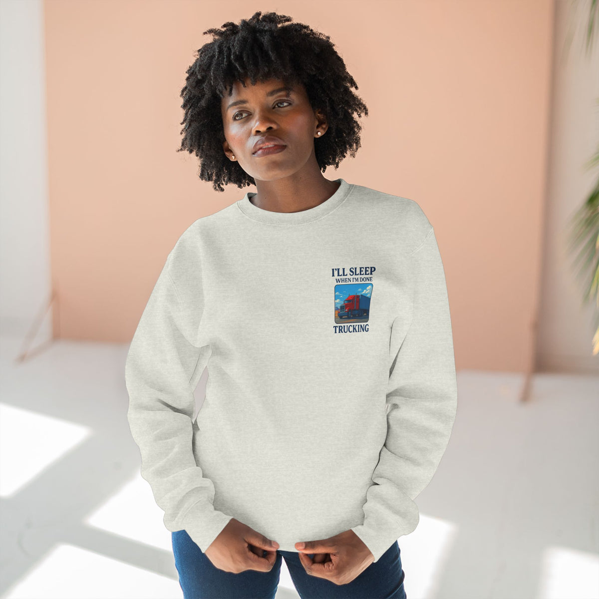 Heather grey Trucker Life unisex crewneck sweatshirt with "I'll Sleep When I'm Done" graphic print, casual and comfortable clothing.