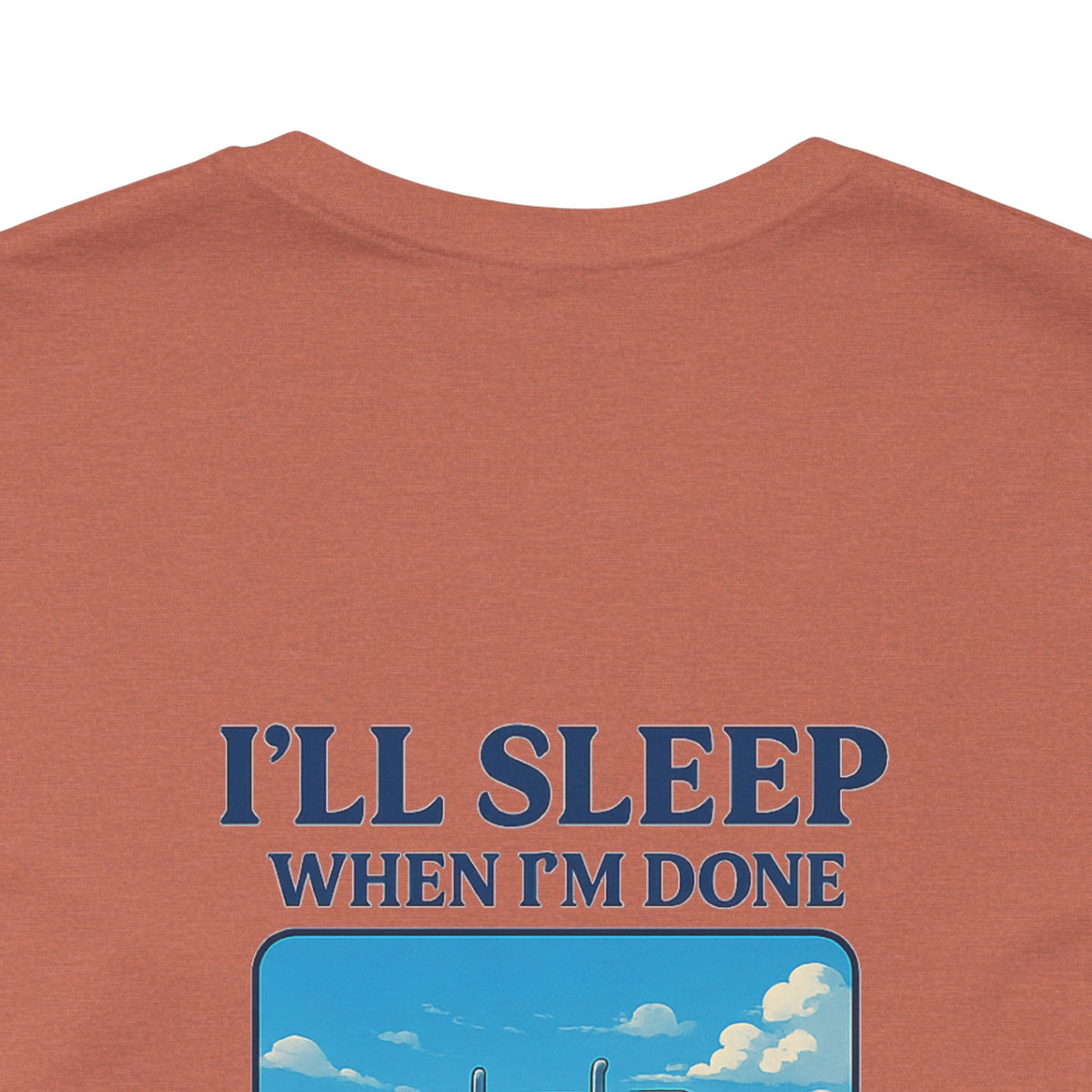 Unisex Heather Grey T-shirt with "I'll Sleep When I'm Done Trucking" slogan, short sleeve, casual fit for truckers.
