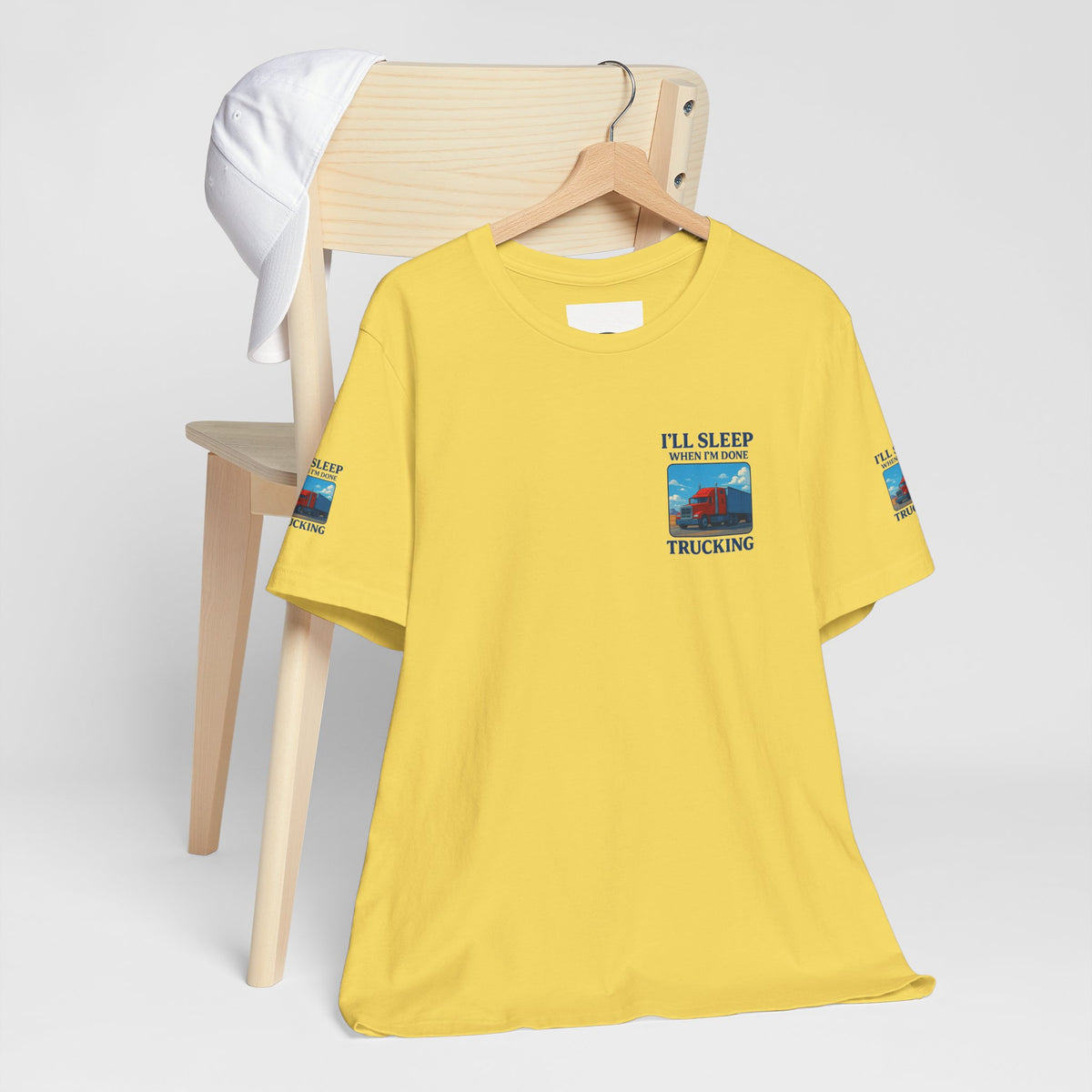 Unisex Heather Grey T-Shirt with "I'll Sleep When I'm Done Trucking" slogan, short sleeve, casual fit for truckers.