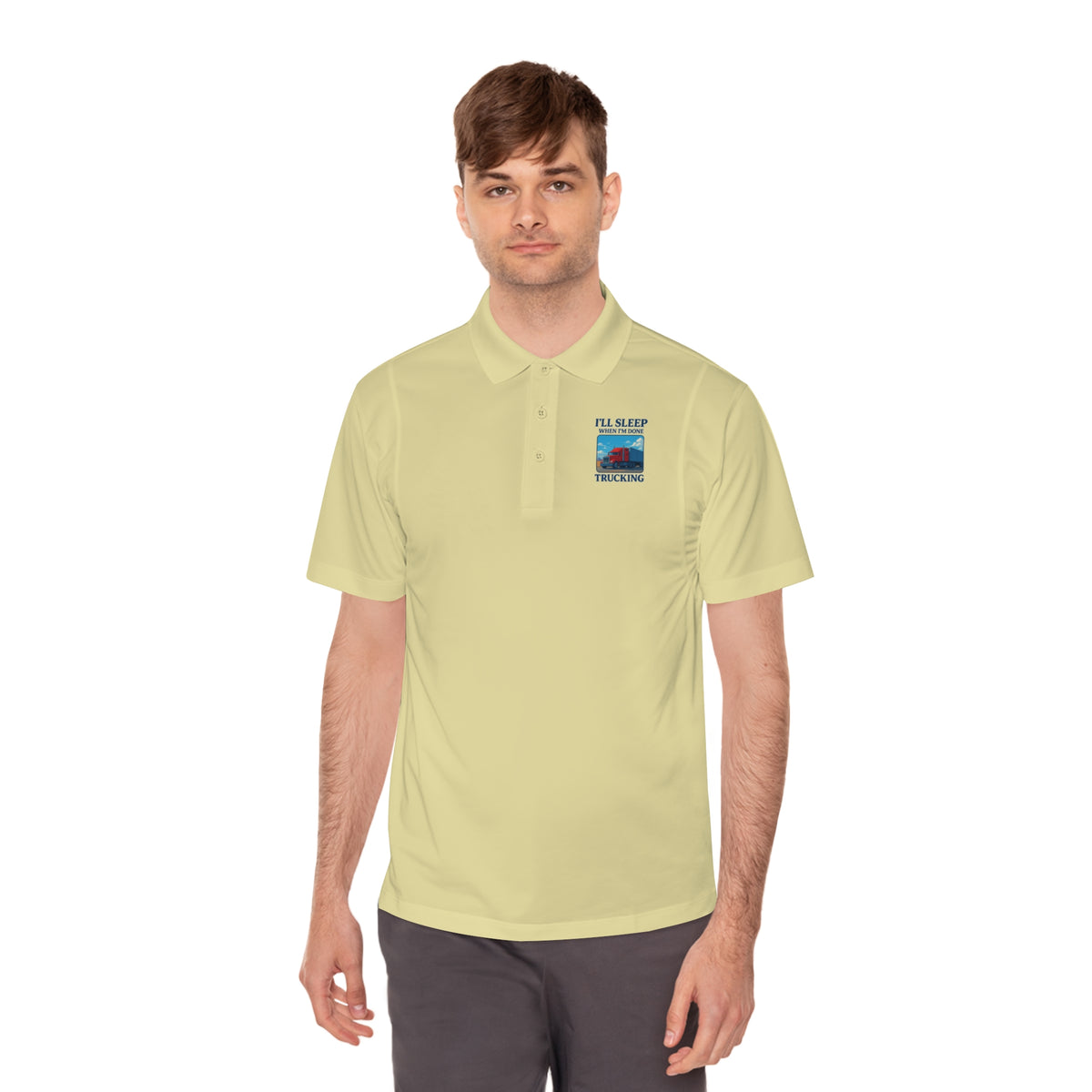 Men's blue sport polo shirt by Printify featuring a trucking design with the slogan "I’ll Sleep When I’m Done" printed on the front.