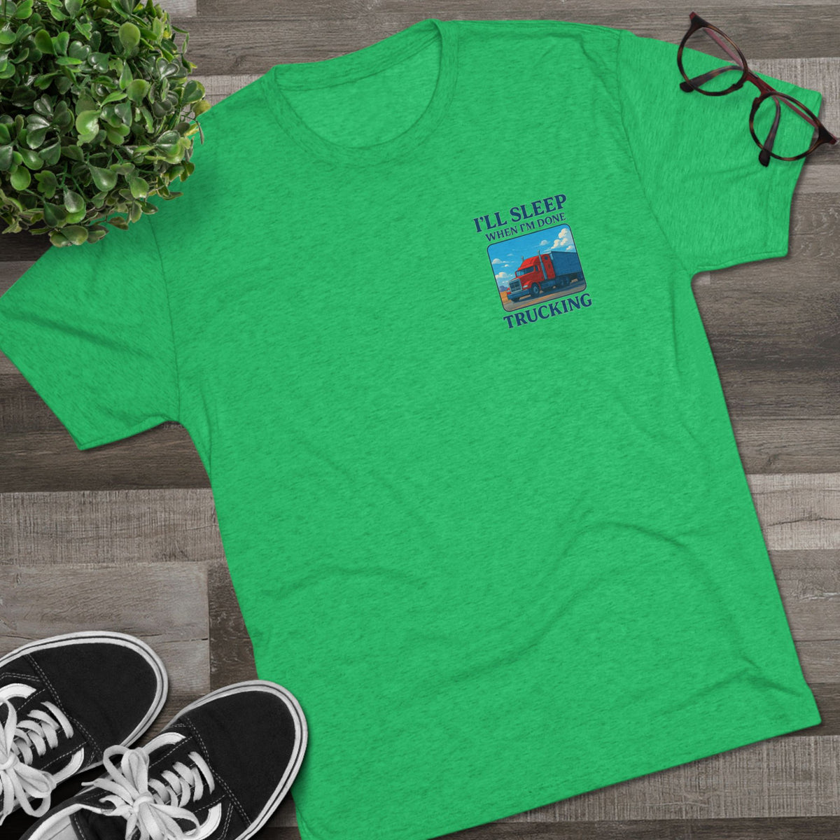 Unisex crew T-shirt with "I'll Sleep When I'm Done" slogan for truck drivers, Printify brand, black tri-blend fabric.