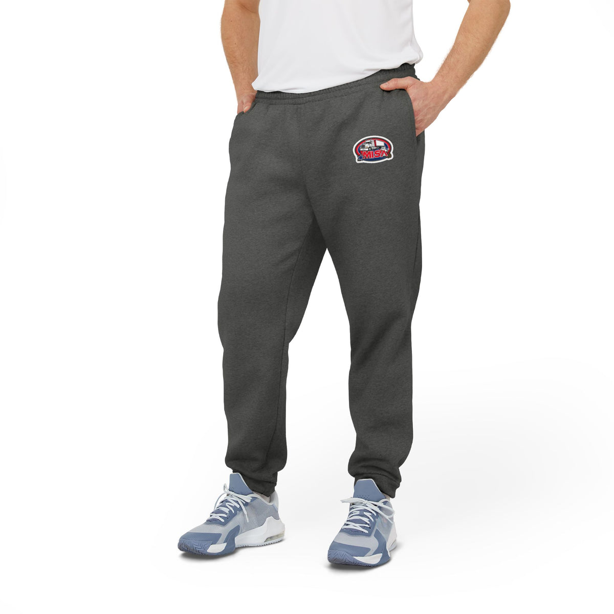 Black adidas unisex fleece joggers, comfortable athleisure trousers with elastic waistband and relaxed fit for casual wear.